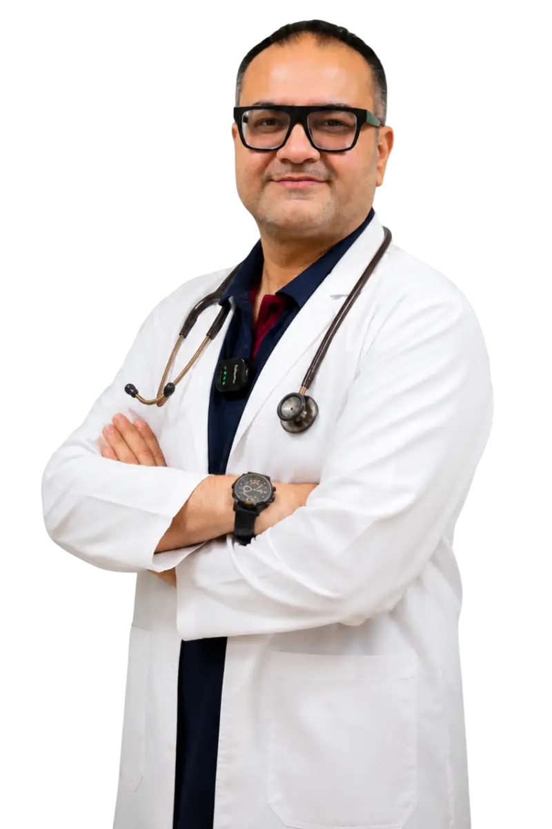 Dr. Allenca, DOGRI physician, standing with arms crossed in medical scrubs
